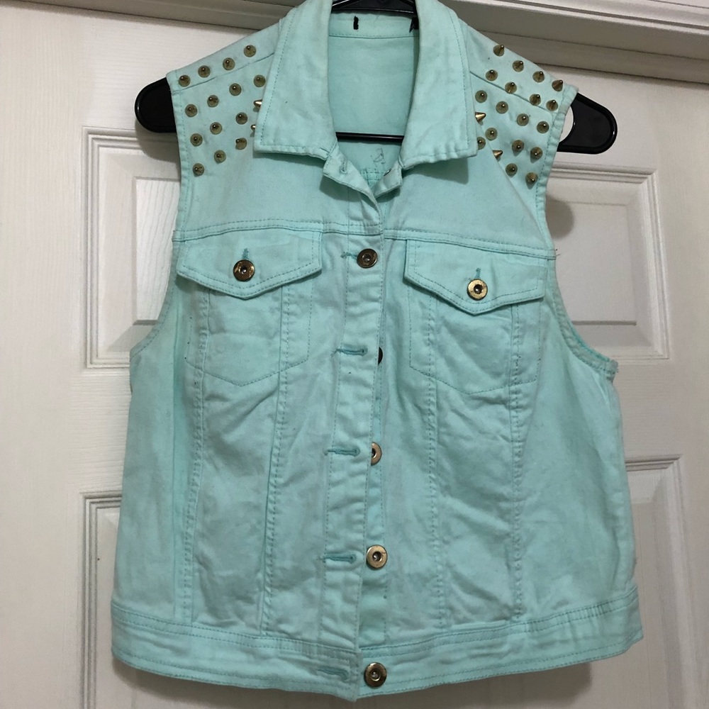 Teal vest with gold spikes on shoulders